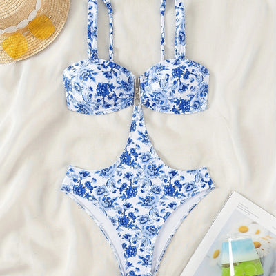 Blue and white floral one-piece swimsuit with a V-bar detail and side cut-outs, perfect for summer. - Image 4