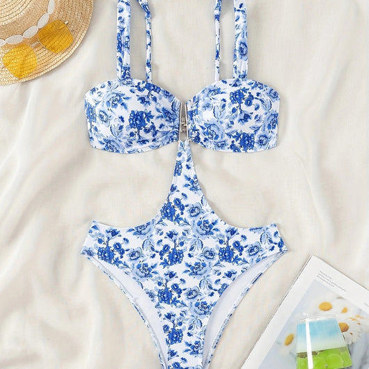 Blue and white floral one-piece swimsuit with a V-bar detail and side cut-outs, perfect for summer. - Image 4