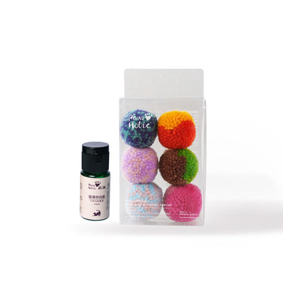 Two fluffy cat pom-pom toys, one pink and blue, one pink, in a clear box with a small bottle of catnip hydrosol. - Image 13