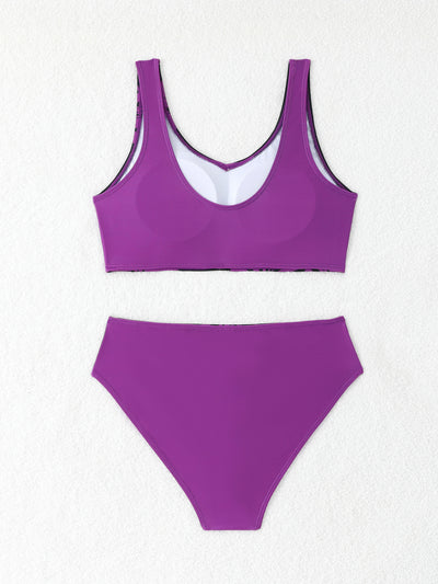 Women's two-piece swimsuit with black and purple floral print. Features a V-neck sports bra top and mid-rise bottom. - Image 31