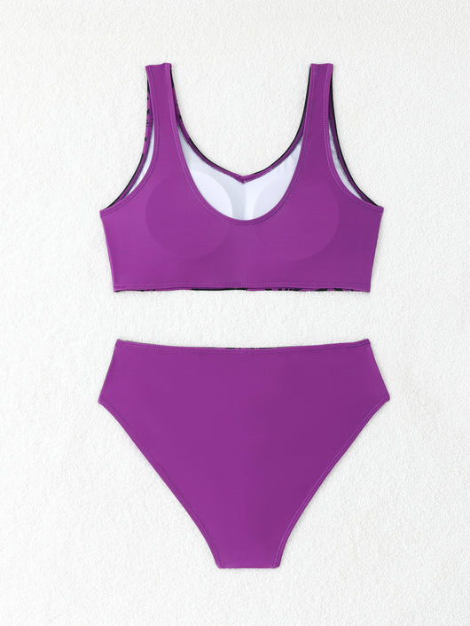 Women's two-piece swimsuit with black and purple floral print. Features a V-neck sports bra top and mid-rise bottom. - Image 31
