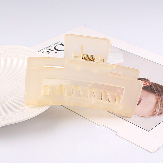 Frosted light blue rectangular hair claw clip with a gold-toned spring mechanism, ideal for securing hair. - Image 17