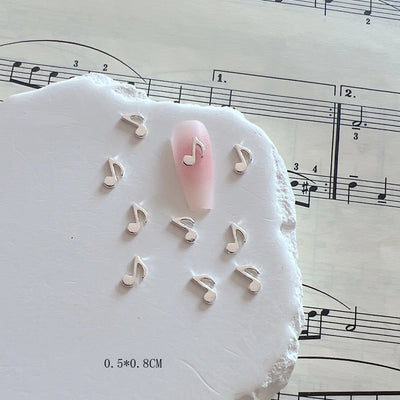 Accesorios de Uñas Metálicos con Símbolos Musicales - Image 4