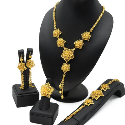 Gold-plated jewelry set with filigree flower designs, including a necklace with dangling chains, matching earrings, a ring, and a bracelet. - Image 7