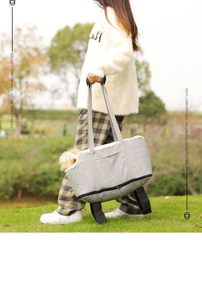 Grey pet car seat with plush white lining, designed for small dogs or cats, placed on a car's center console. - Image 12