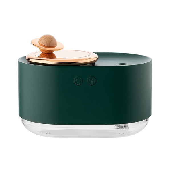 White USB rechargeable mini humidifier with a rose gold top accent and a wooden planet decoration.