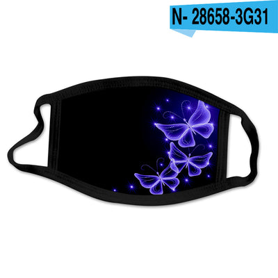 Black cotton face mask with a glowing pink butterfly and blue abstract pattern, worn by a woman. - Image 6