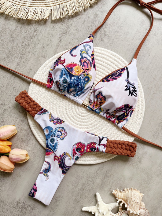 Women's blue, white, and gold marble print bikini with a triangle halter top and braided rope side details. - Image 29