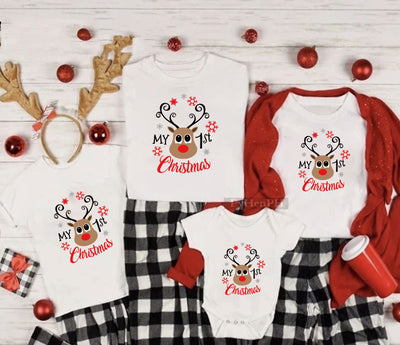 Family matching white Christmas t-shirts and baby bodysuit with 'Merry Christmas' graphic, paired with black and white plaid pajama bottoms. - Image 6
