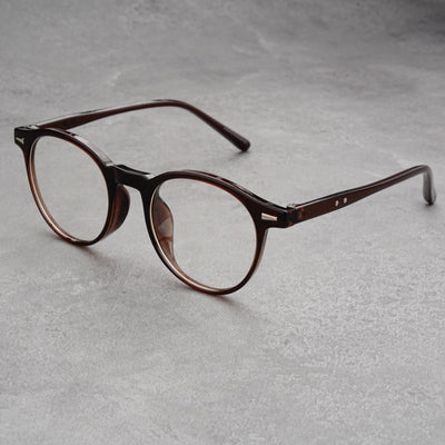 Fashionable round-frame sunglasses with transparent gray frames and dark gray lenses on a gray surface. - Image 15