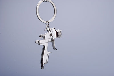 Llavero Pistola de Agua para Hombre - Juguete Miniatura Portátil - Image 3
