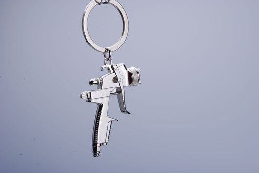 Llavero Pistola de Agua para Hombre - Juguete Miniatura Portátil - Image 3
