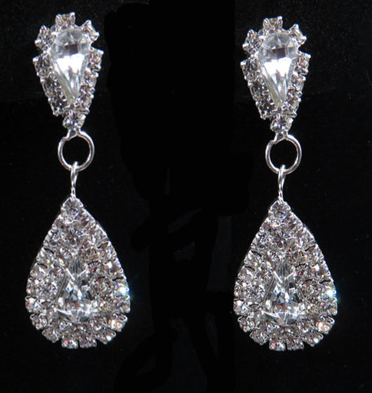 Sparkling silver-tone bridal jewelry set with a rhinestone necklace and matching teardrop drop earrings on a black bust. - Image 6