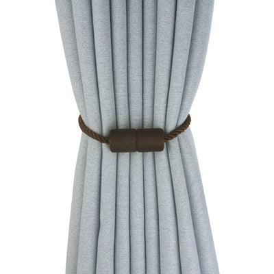 Black cylindrical magnetic curtain tieback holding a light blue pleated curtain, against a clean white background. - Image 8