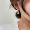 Aretes de Flor Madreperla Doble Capa - Elegancia Femenina