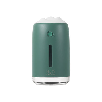 Dark night green mini humidifier with a white mountain-shaped top, clear base, and visible water level indicator. - Image 13