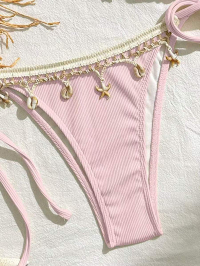 Light pink ribbed halterneck bikini with triangle cups and tie-side bottom, adorned with shell and starfish charms. - Image 21