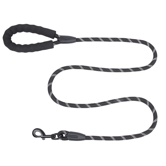 Purple pet harness with reflective straps, a top handle, and a metal D-ring for leash attachment. - Image 11