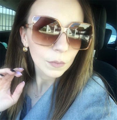 Oversized square sunglasses with a black and tortoiseshell frame and gradient purple lenses, shown from two angles. - Image 13