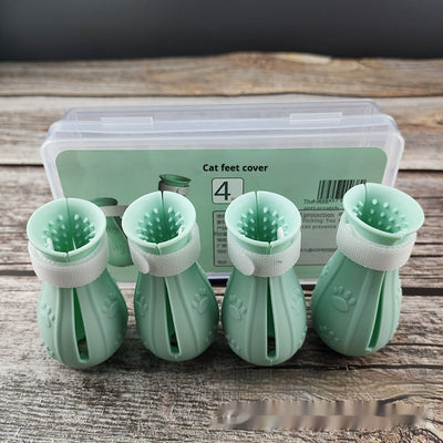 Four teal rubber cat paw covers with white hook-and-loop straps and paw print details, designed for anti-scratch protection. - Image 5