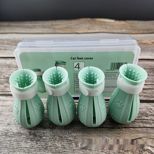 Four teal rubber cat paw covers with white hook-and-loop straps and paw print details, designed for anti-scratch protection. - Image 5