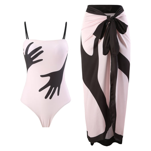 Women's light pink one-piece bikini with black handprint pattern and matching tie-waist sarong. - Image 10