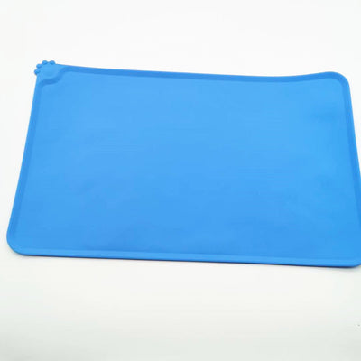 Blue rectangular silicone pet placemat with a raised edge and a small paw print detail in the corner. - Image 6