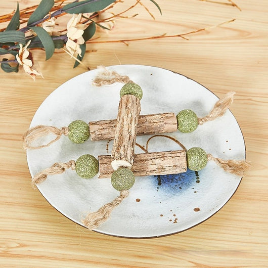 Mutian Liao stick catnip toy shaped like a dumbbell, with three wooden sticks and six green catnip balls.