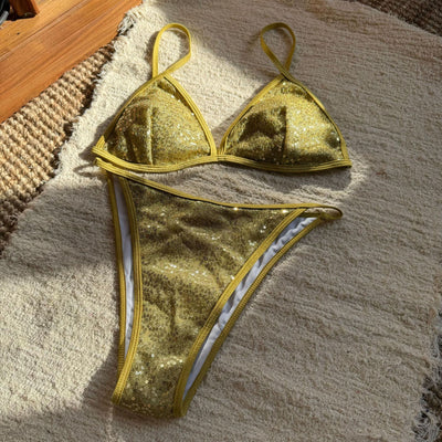 Woman wearing a black sequined triangle bikini top and high-cut bottom on a sunny beach. - Image 21
