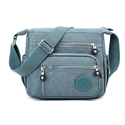 Bolsa Mensajero de Hombro Grande con Capacidad Expandible para Viajes - Image 10