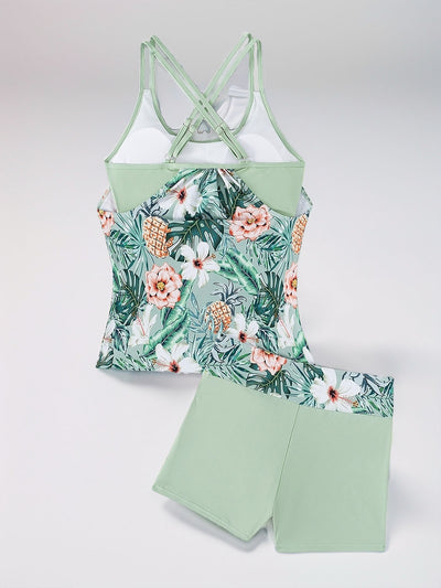 Women's light green high-waisted tankini swimsuit with tropical floral print top and solid swim shorts. - Image 16