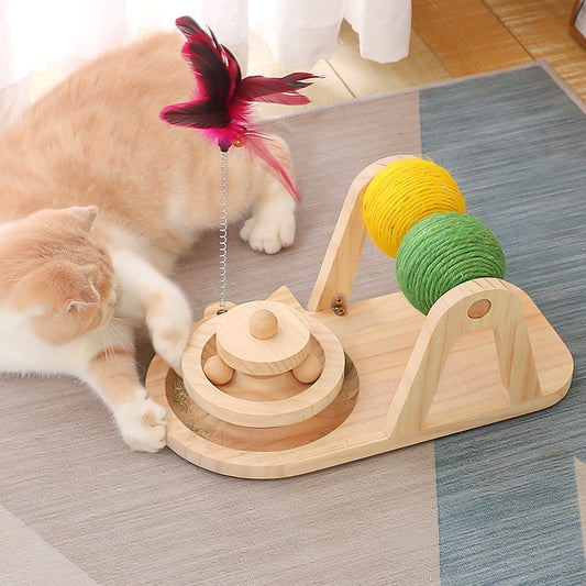 Solid wood cat toy with a tiered ball track, a spring-loaded feather wand, and green and yellow sisal rollers.
