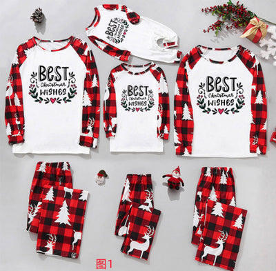 Matching family Christmas pajamas in red and black plaid with "Merry Christmas" text, tree, and reindeer prints. - Image 7
