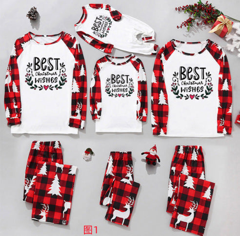 Matching family Christmas pajamas in red and black plaid with "Merry Christmas" text, tree, and reindeer prints. - Image 7