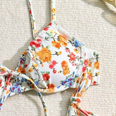 Women's white floral two-piece bikini with red, orange, and blue flowers, featuring a tie-front top and tie-side bottoms. - Image 5