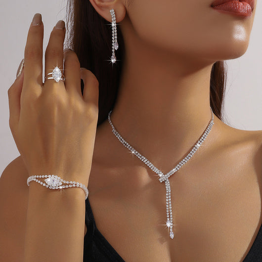 Sparkling rhinestone necklace, dangle earrings, and bracelet set on a black display, perfect for formal events. - Image 10