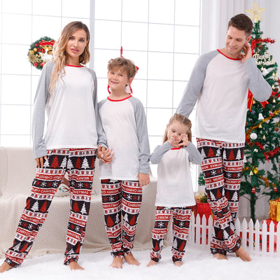 Family of four wearing matching Christmas pajamas with 'MERRY Christmas' text, leopard print, and plaid trees. - Image 3