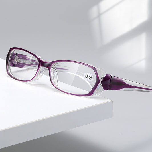 Red and clear retro full-frame reading glasses with blue light blocking lenses and a +2.00 prescription.