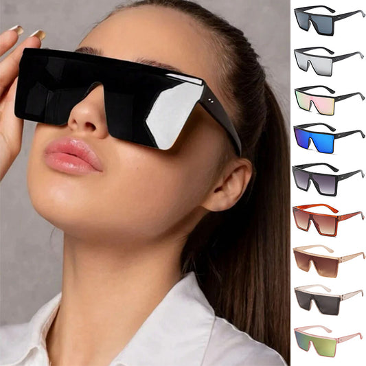 Fashion one-piece large rim sunglasses with a transparent champagne frame and brown gradient lenses.