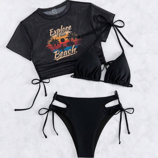 Black three-piece swimsuit with a mesh crop top featuring an "Explore the Beach" graphic, bikini top, and high-waisted bottoms. - Image 2