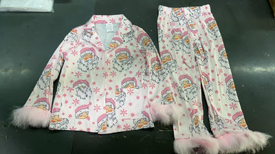 Young girl in a leopard print pajama set with black feather trim on the cuffs and ankles, wearing a pink glitter headband. - Image 15