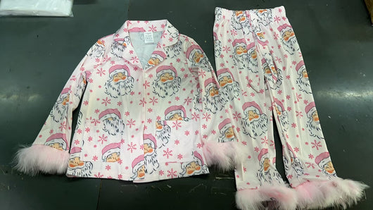 Young girl in a leopard print pajama set with black feather trim on the cuffs and ankles, wearing a pink glitter headband. - Image 15