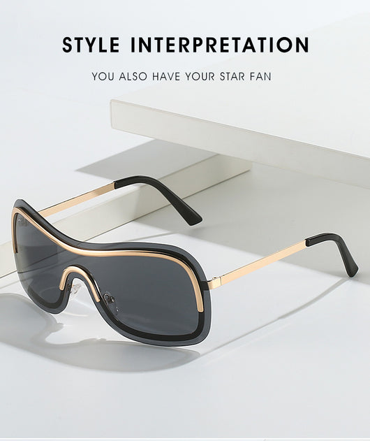 Women's fashionable shield sunglasses with a gold metal frame and dark gray lenses, featuring a unique wavy design. - Image 16
