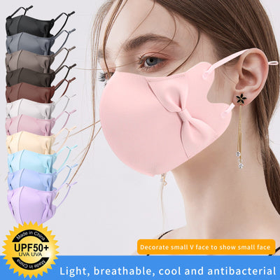 Light blue ice silk face mask with decorative bows on the sides and adjustable ear loops, shown on a white background.