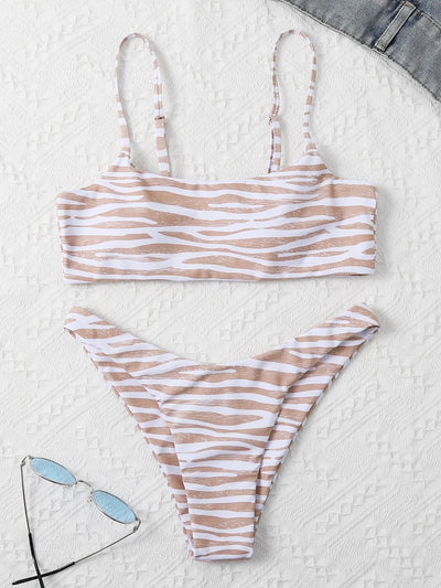 Tan and white zebra stripe two-piece bikini with a bandeau top and high-cut bottom, laid flat. - Image 24