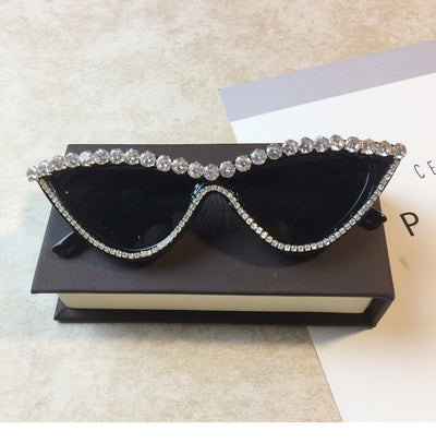 Two pairs of cat-eye sunglasses, one black with clear rhinestones and one pink with pink rhinestones, on a light surface. - Image 10