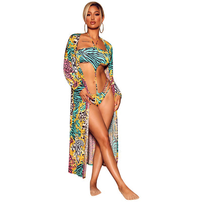 Women's fashion print two-piece swimsuit with a matching long-sleeve cape, featuring vibrant blue, yellow, pink, and black patterns. - Image 14