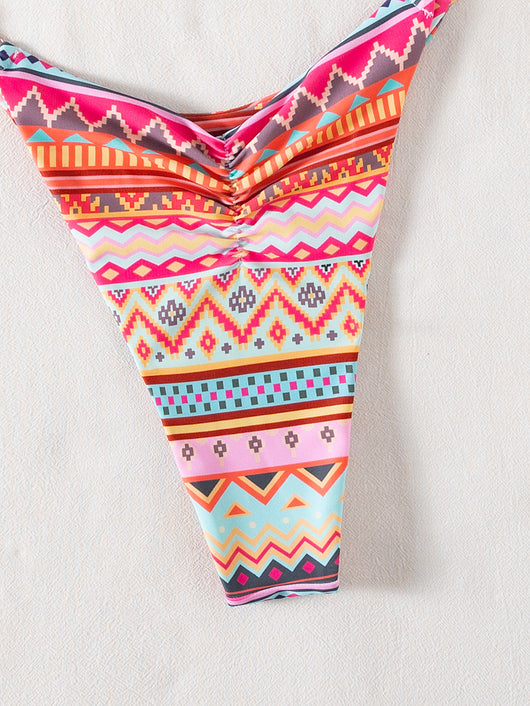 Vibrant geometric print triangle-bra bikini swimsuit with adjustable ties and high-cut ruched bottom. - Image 16