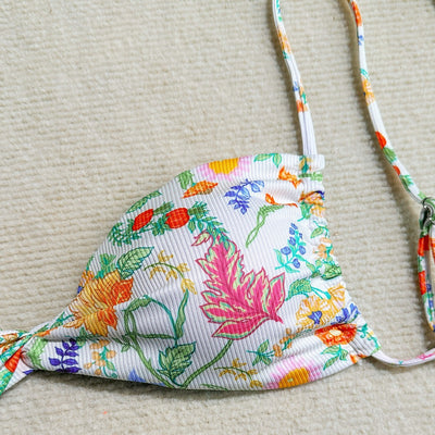 White ribbed two-piece bikini with colorful floral print, featuring a bandeau top and high-cut bottom. - Image 3