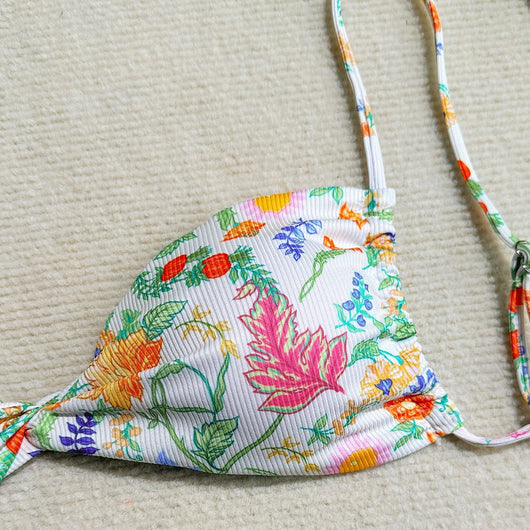 White ribbed two-piece bikini with colorful floral print, featuring a bandeau top and high-cut bottom. - Image 3